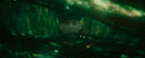 a blurry picture of a person in a dark room .