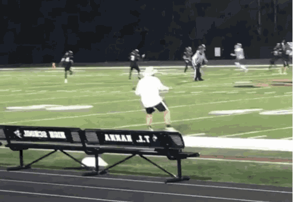 a football game is being played on a field with a bench that says annan j.t.