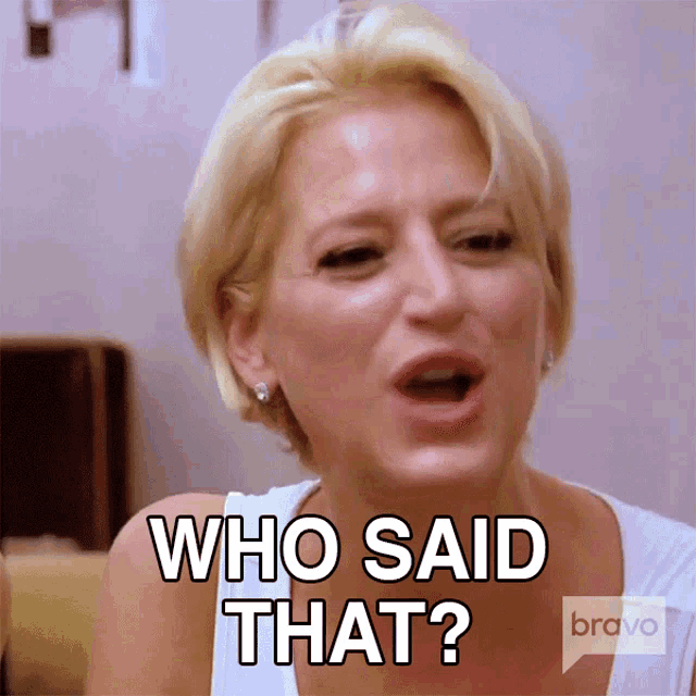 a woman says " who said that " while wearing a white shirt