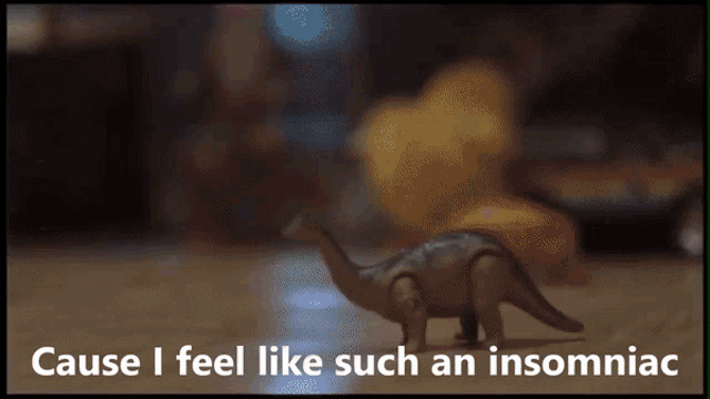 a picture of a toy dinosaur with the words cause i feel like such an insomniac below it