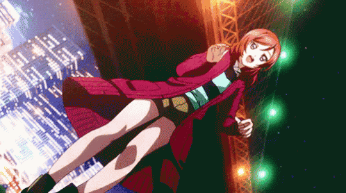 a girl in a red coat and shorts is standing on a stage
