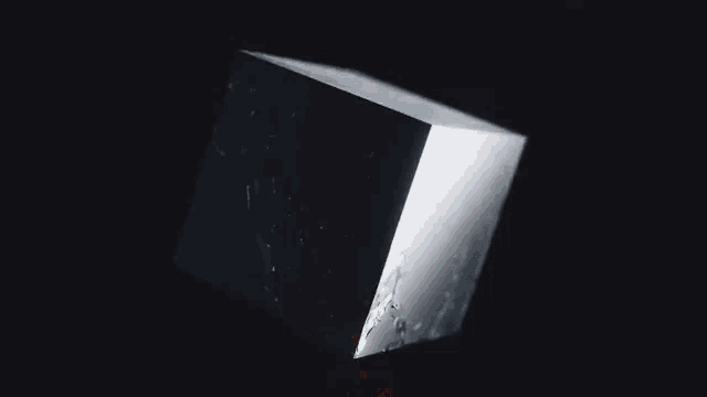 a black and white image of a broken glass object