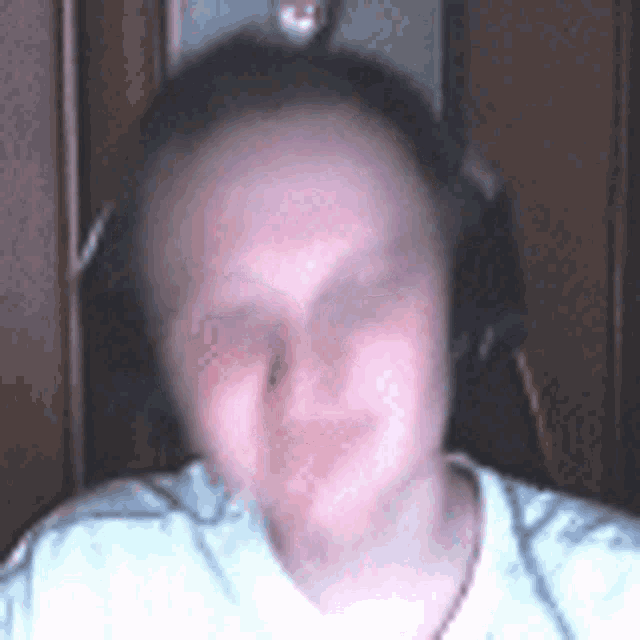 a woman wearing headphones is sitting in a chair .