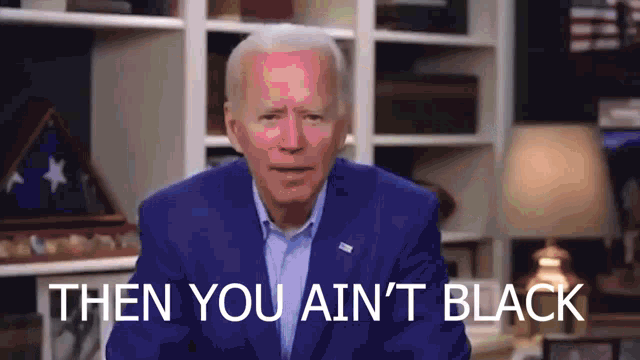 a man in a blue suit says then you ain t black