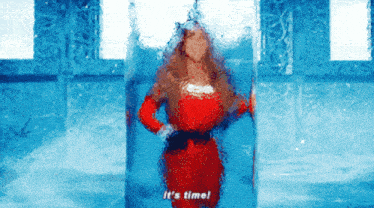a woman in a red dress says it 's time in a blue room