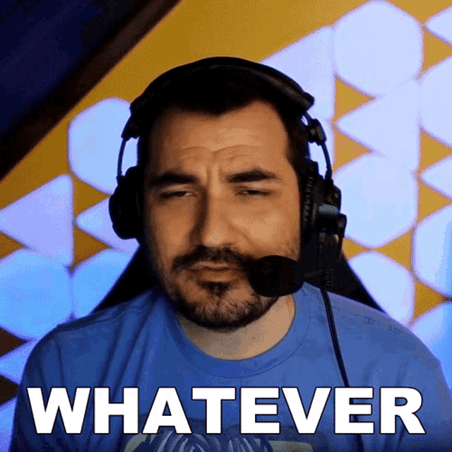 a man wearing headphones and a blue shirt has the word whatever on his face