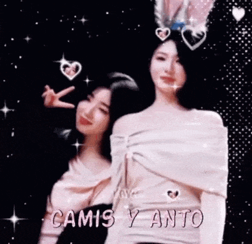 a couple of women are standing next to each other and making a peace sign .