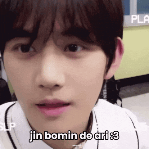 a close up of a person 's face with the words jin bomin de ari written on the bottom