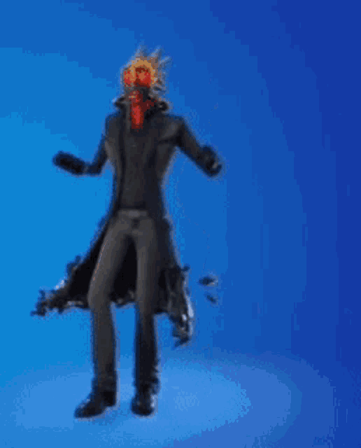a man with spikes on his head and red eyes is standing on a blue background .