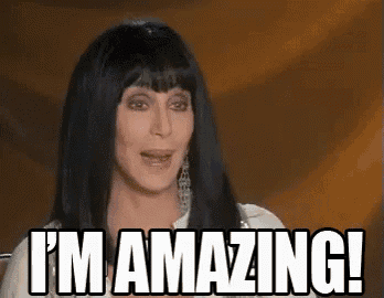 a woman with long black hair is saying i 'm amazing