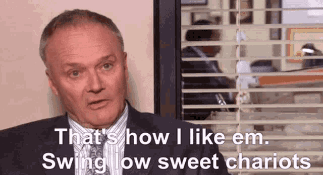 a man in a suit and tie says that 's how i like em swing low sweet chariots .