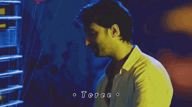 a man wearing a white shirt with the word toree on it