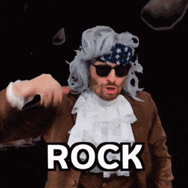 a man wearing a wig and sunglasses is pointing at the word rock
