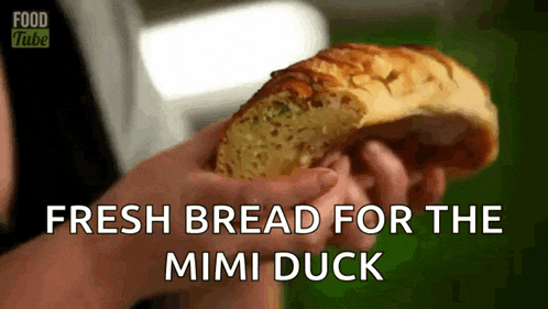 a person holding a loaf of bread with the words fresh bread for the mimi duck