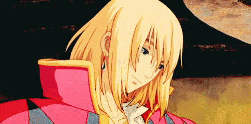 a close up of a person 's face with blonde hair and a red jacket .
