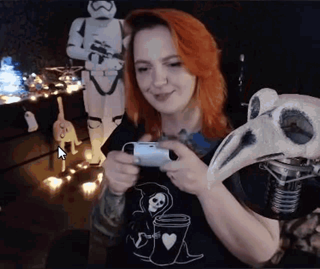a woman is playing a video game on a playstation 4 while holding a bird skull .