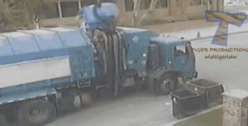 a tiger productions logo can be seen behind a blue garbage truck