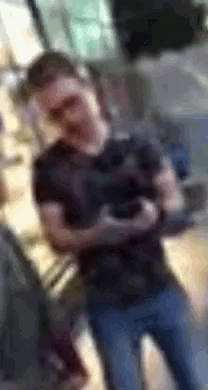 a blurry picture of a man in a black shirt