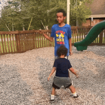 a boy wearing a blue shirt that says future chicken king
