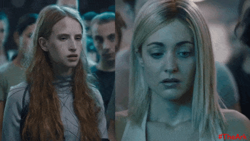 a woman with her eyes closed is next to another woman