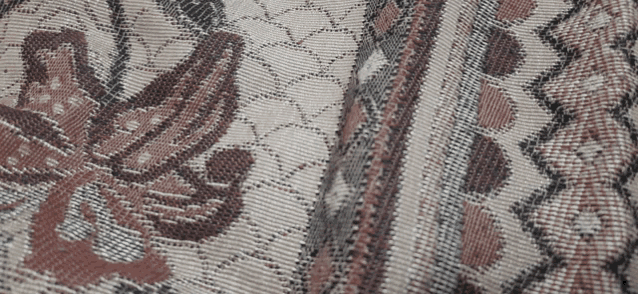 a close up of a blanket with a floral pattern on it
