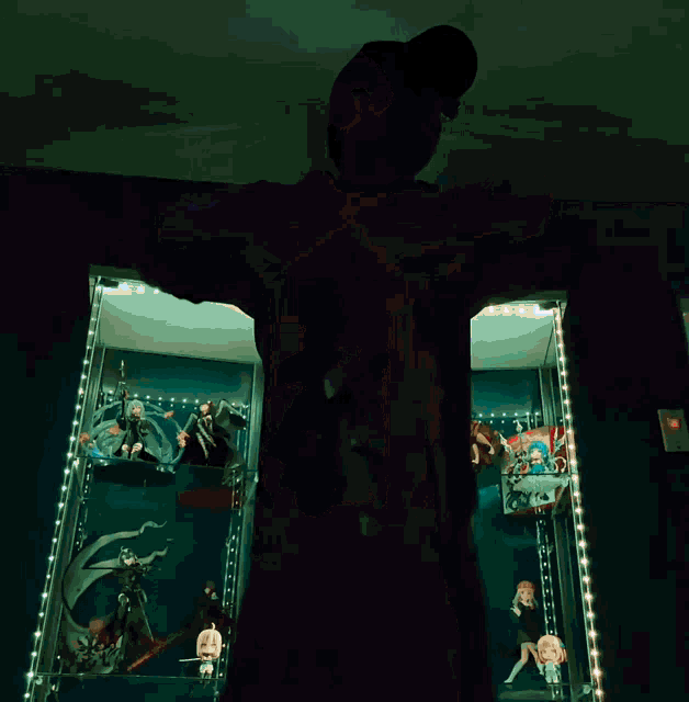 a person is standing in front of a display case with a blue light on it