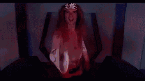 a man with long red hair and a crown on his head