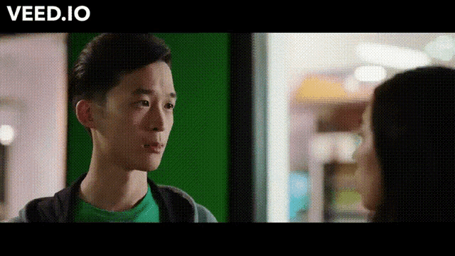 a man and a woman are looking at each other and the words veed.io are above them