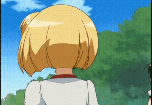 a girl with blonde hair and a white shirt stands in front of trees