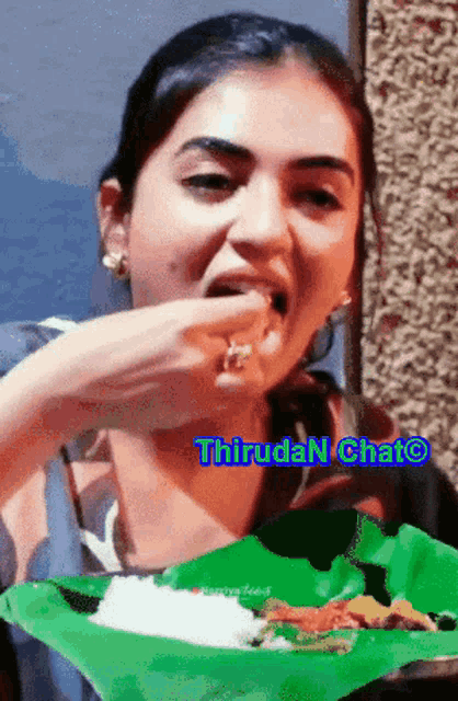 a woman is eating rice from a green plate with the words thiruda n chat written below her