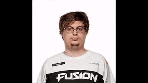 a man with glasses and a beard is wearing a white and black shirt with the word fusion on it .