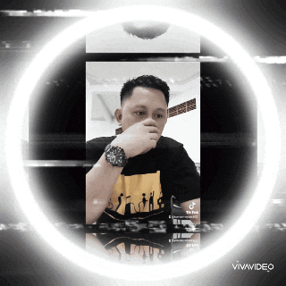 a man wearing a watch is surrounded by a white circle that says vivavideo on it