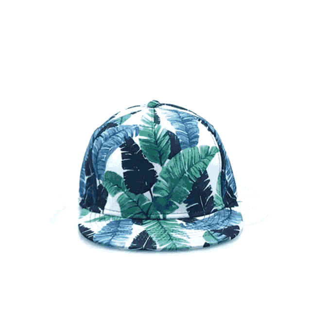 a white baseball cap with blue leaves on it