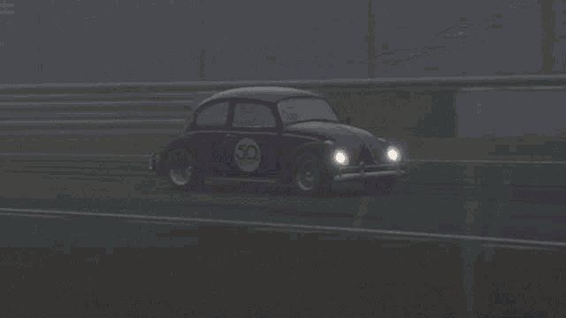 a purple car is driving down a race track