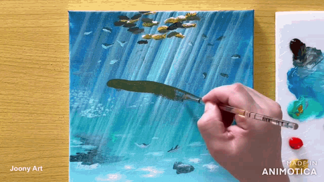 a painting of a waterfall is being painted by a person