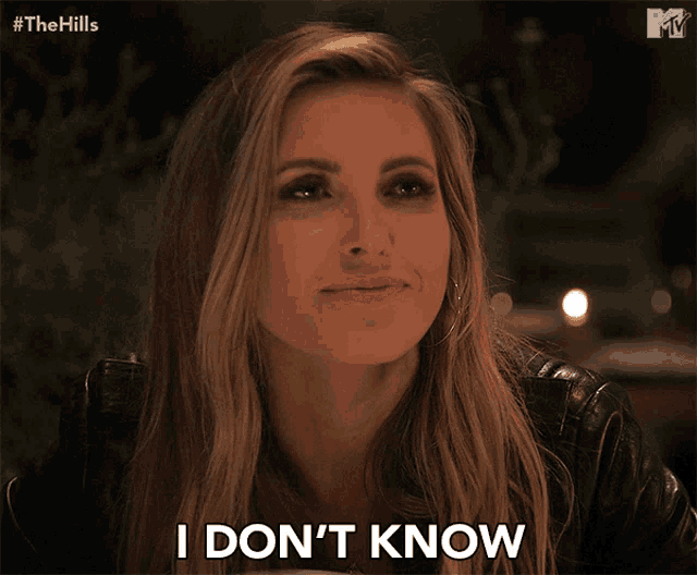 a woman says " i don 't know " while wearing a black leather jacket