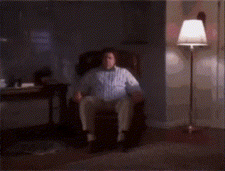 a blurry picture of a man in a white shirt laying down