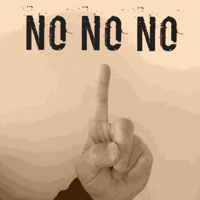 a person 's finger is pointing up in front of the word no