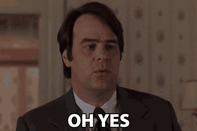 a man in a suit says oh yes