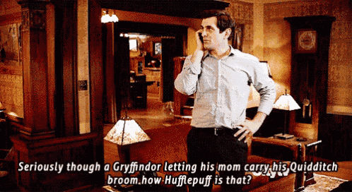 a man talking on a cell phone in a living room with a caption that says seriously though