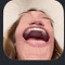a close up of a person 's mouth with their mouth open .