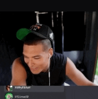 a man wearing a green hat is smiling in a screenshot
