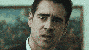 a close up of a man 's face with a serious look on his face