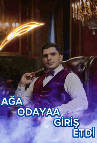 a man in a vest and bow tie smoking a cigar with the words aga odayaa giriş etdi below him
