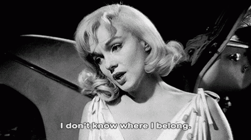 a black and white photo of a woman with the words " i don t know where i belong "