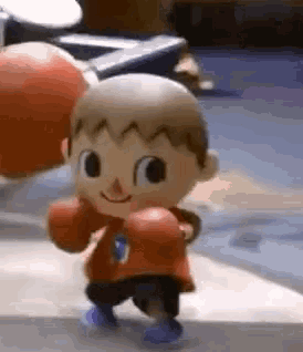 a cartoon character wearing boxing gloves is walking on a sidewalk .