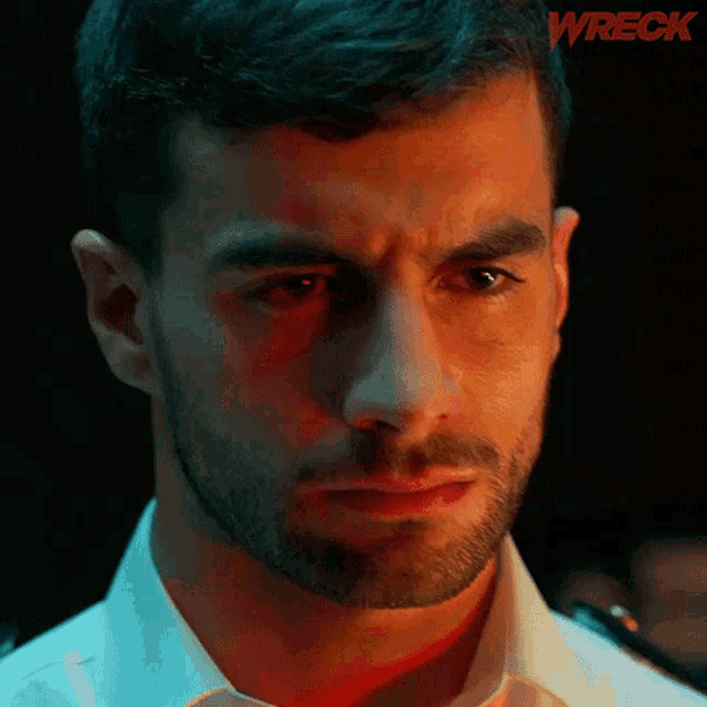 a close up of a man 's face with the word wreck in the corner