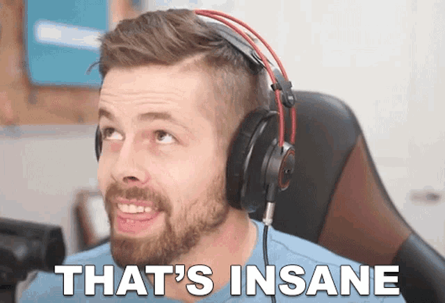 a man wearing headphones with the words that 's insane on the bottom