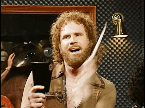 a man with a beard is holding a drum stick in his hand