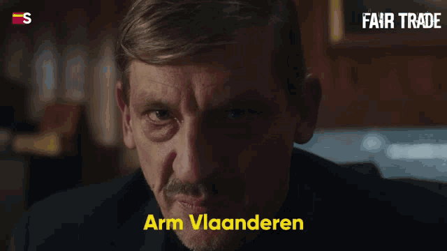 a man with a mustache and the words arm vlaanderen on the bottom